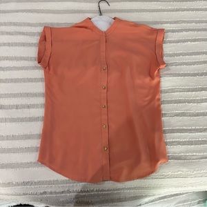 Women’s capped sleeve blouse.
